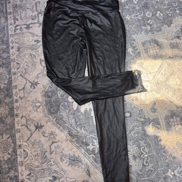 Sleek black faux leather leggings. Perfect for a chic look. - Picture 2 of 6